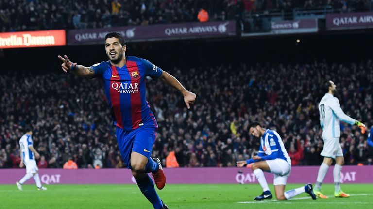 Luis Suarez of FC Barcelona celebrates after scoring his team's first goal during the La Liga match v Espanyol