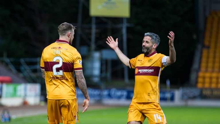 Richard Tait and Keith Lasley celebrate after Motherwell take the lead in Perth
