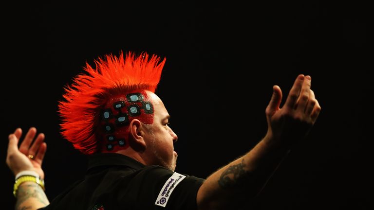 ROTTERDAM, NETHERLANDS - MAY 12:  Peter Wright of Scotland dances for the fans before he plays against Raymond van Barneveld of the Netherlands during the 