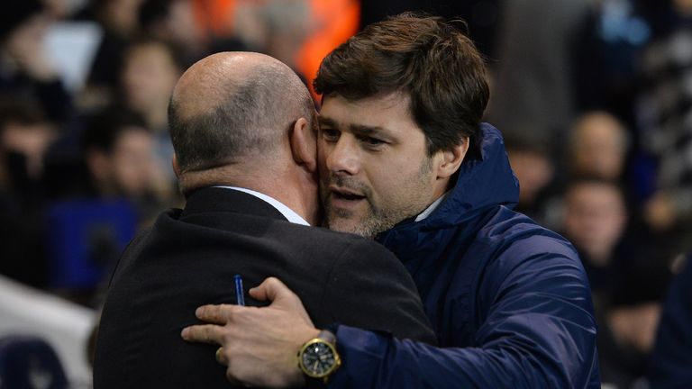 Mauricio Pochettino hugs Mike Phelan at full-time after Tottenham's win over Hull