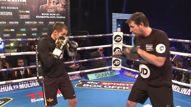 Scott Quigg works the pads with trainer Joe Gallagher