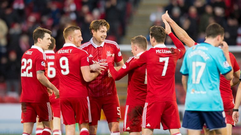Aberdeen's Ash Taylor celebrates scoring their opening goal