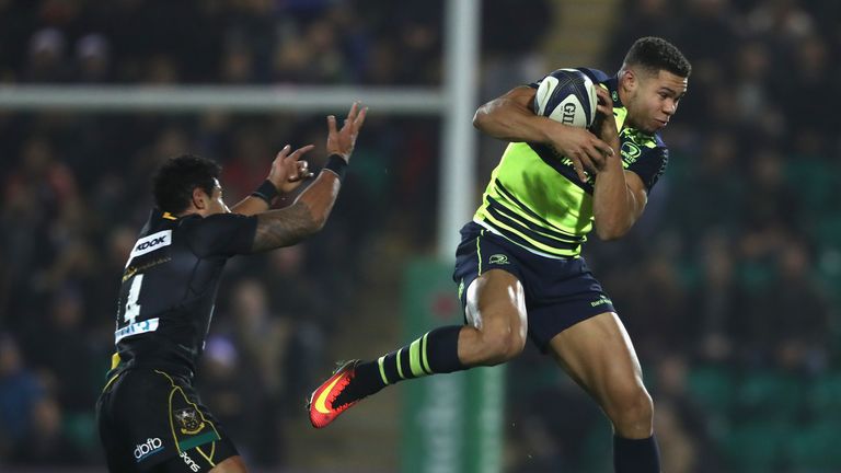 NORTHAMPTON, ENGLAND - DECEMBER 09:  Adam Byrne of Leinster catches the ball as Ken Pisi challenges during the European Rugby Champions Cup match between N