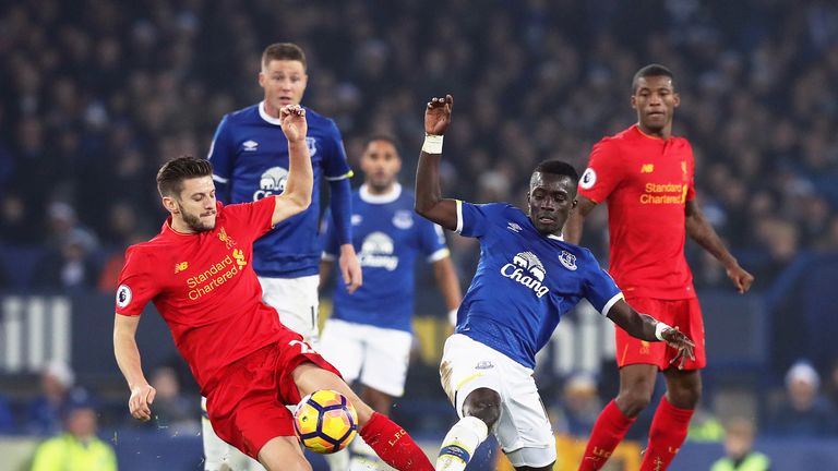 Adam Lallana and Idrissa Gueye battle for the ball