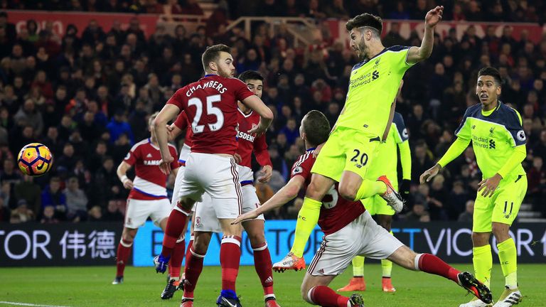 Adam Lallana heads in the opening goal of the game