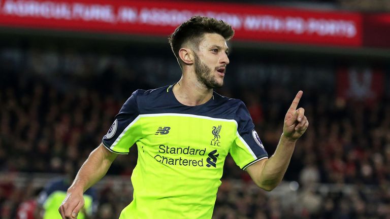 Adam Lallana celebrates scoring his second and Liverpool's third goal