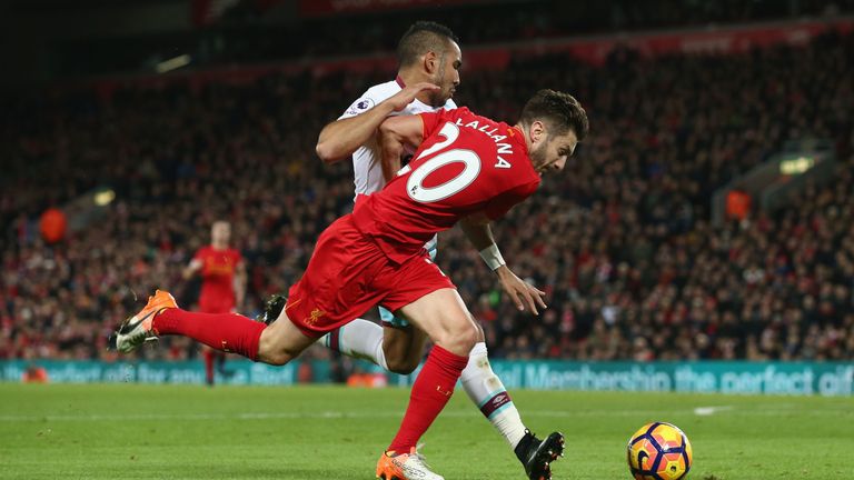 Liverpool's Adam Lallana vies with West Ham's Dimitri Payet