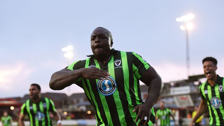 ACCRINGTON, ENGLAND - MAY 18:  Adebayo Akinfenwa of AFC Wimbledon celebrates after scoring a goal to level the aggregate scores at 2-2 during the Sky Bet L