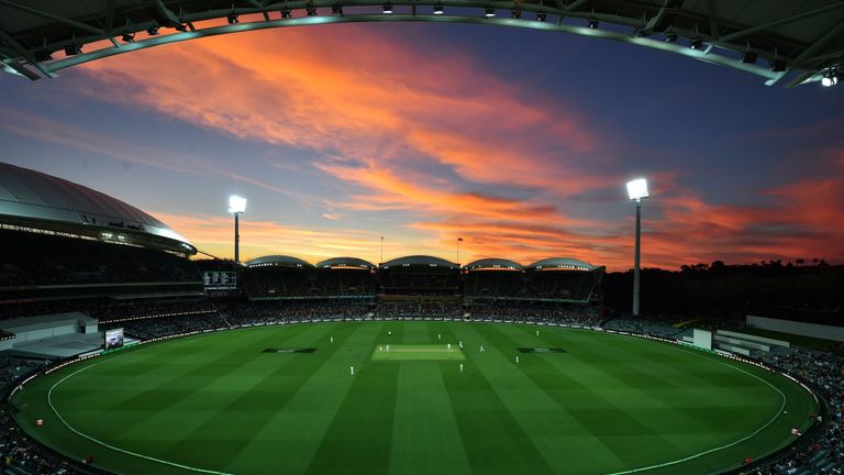 TOPSHOT - The sun sets during the first innings of the day-night third Test cricket match between Australia and South Africa at the Adelaide Oval in Adelai