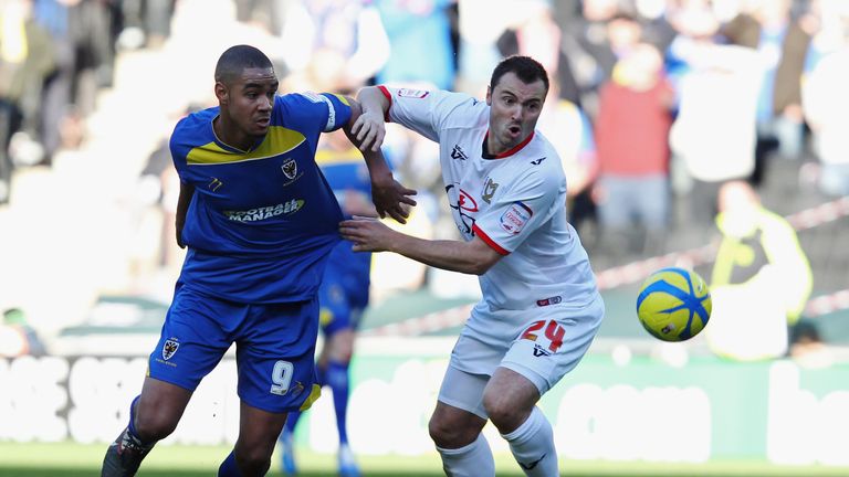 MILTON KEYNES, ENGLAND - DECEMBER 02: Antony Kay of MK Dons battles with Byron Harrison of AFC Wimbledon during the FA Cup with Budweiser Second Round matc