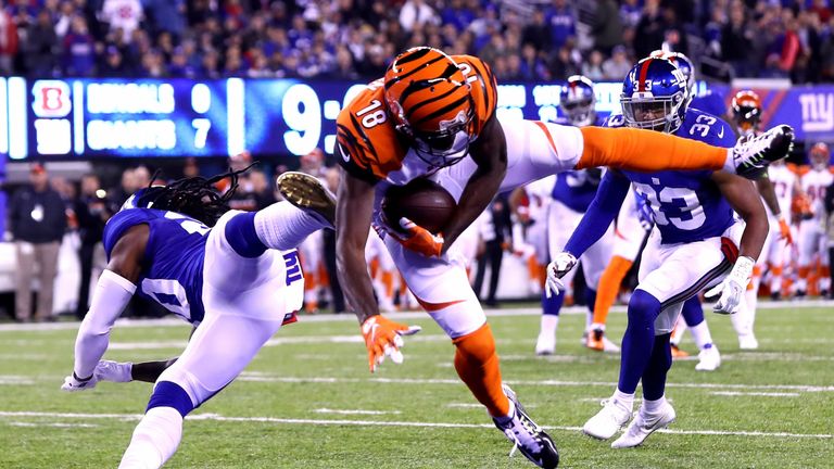 EAST RUTHERFORD, NJ - NOVEMBER 14:   A.J. Green #18 of the Cincinnati Bengals catches a touchdown pass against Janoris Jenkins #20 of the New York Giants d