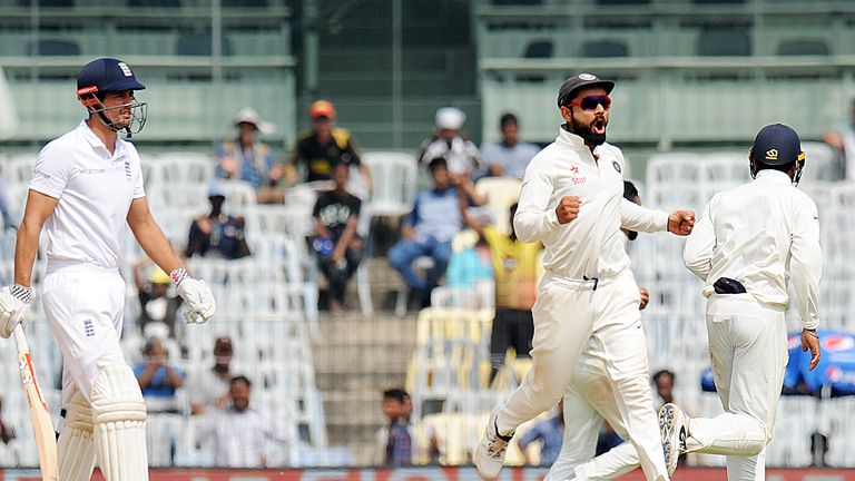 India's captain Virat Kohli (2R) celebrates the wicket of England's captain Alastair Cook (L) during the fifth day of the fifth and final Test cricket matc