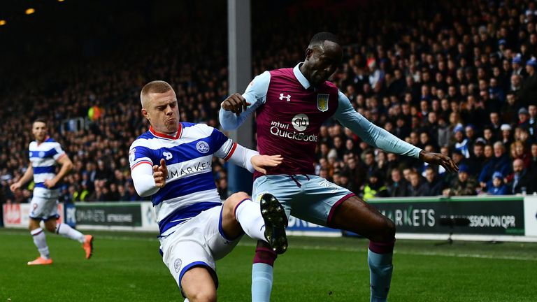 Albert Adomah of Aston Villa holds off Jake Bidwell