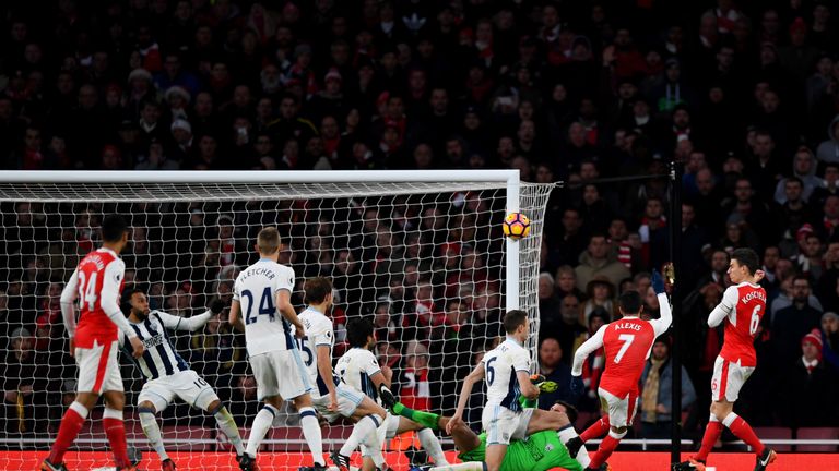 LONDON, ENGLAND - DECEMBER 26:  Alexis Sanchez of Arsenal hits a shot against the post during the Premier League match between Arsenal and West Bromwich Al
