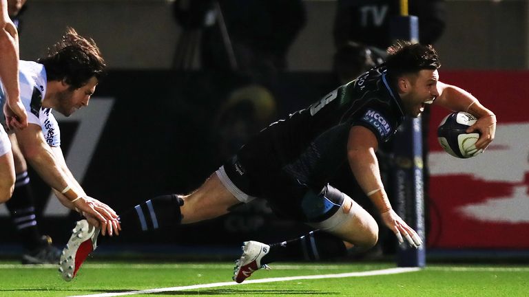Ali Price of Glasgow scores the third try of the game during the European Rugby Champions Cup match between Glasgow and Racing