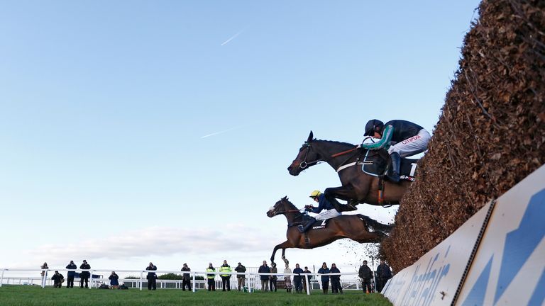 Noel Fehily riding Altior (R) clear the last to win the Racing Post Henry VII Novices' Chase at Sandown 
