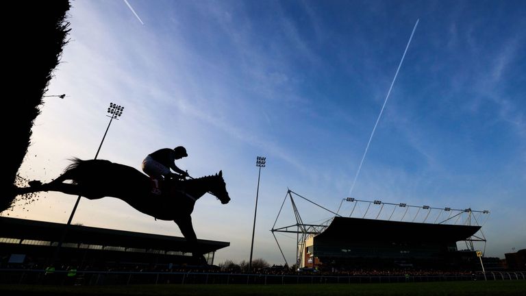 Altior ridden by Noel Fehily is silhouetted as they jump over a fence before winning the 32Red.com Wayward Lad Novices’ Chase during day two of the 32Red
