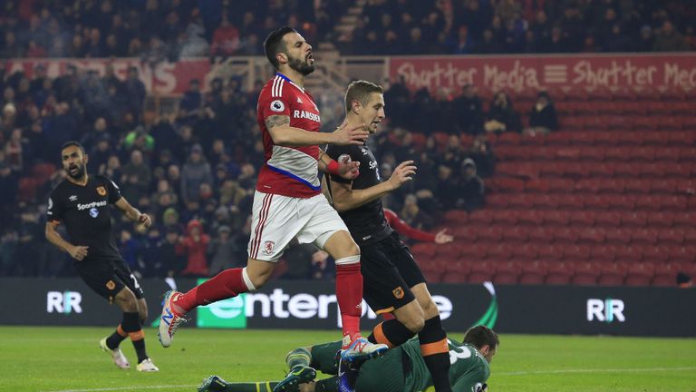 Hull City's Scottish goalkeeper David Marshall (R) saves a shot from Middlesbrough's Spanish striker Alvaro Negredo (L) during the English Premier League f