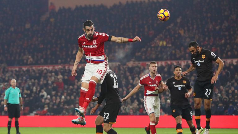 Alvaro Negredo of Middlesbrough beats Ahmed Elmohamady of Hull City to the ball