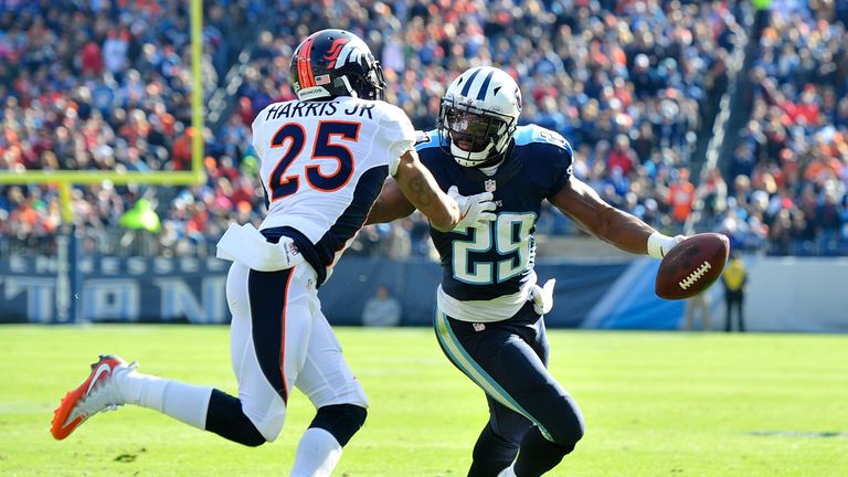 DeMarco Murray #29 of the Tennessee Titans carries the ball against Chris Harris Jr. #25 of the Denver Broncos