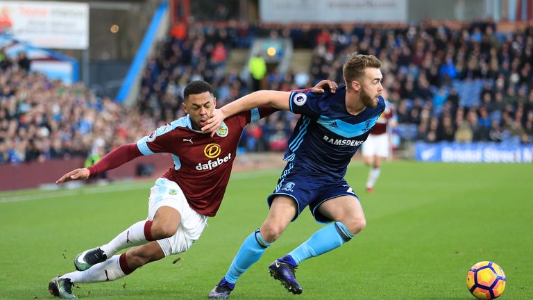 Andre Gray puts pressure on Calum Chambers at Turf Moor