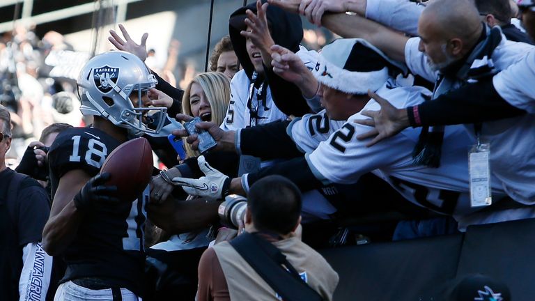 OAKLAND, CA - DECEMBER 24:  Andre Holmes #18 of the Oakland Raiders celebrates after scoring against the Indianapolis Colts during their NFL game at Oaklan