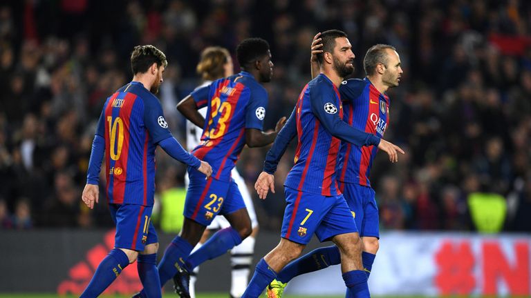 BARCELONA, SPAIN - DECEMBER 06:  Arda Turan of Barcelona (7) celebrates with Andres Iniesta as he scores their second goal during the UEFA Champions League