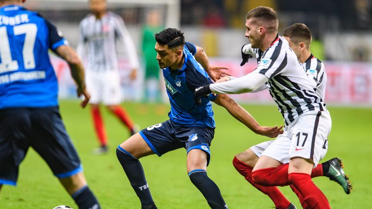 Ante Rebic of Frankfurt challenges Nadiem Amiri of Hoffenheim