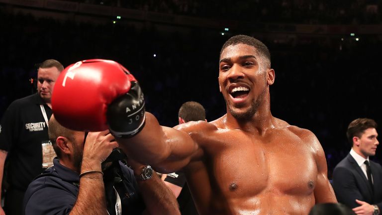 Anthony Joshua celebrates after beating Eric Molina during their IBF World Heavyweight Championship bout