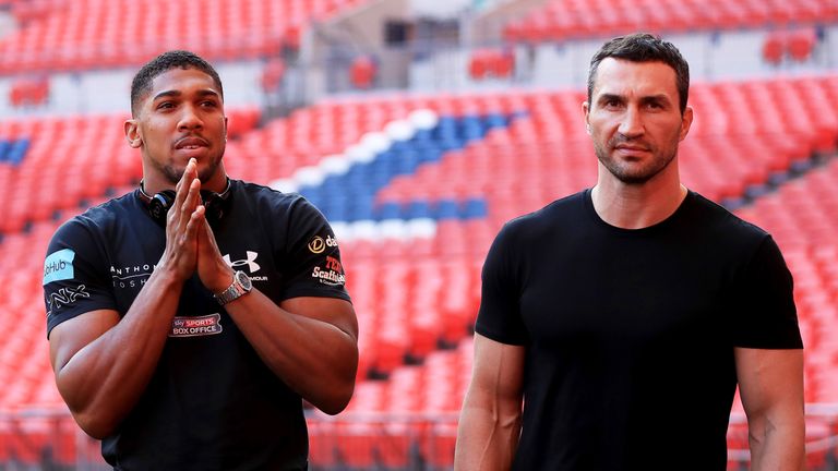 Anthony Joshua and Wladimir Klitschko pose for photographs following the press conference at Wembley Stadium