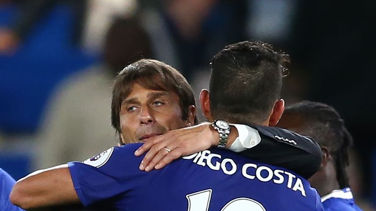 Chelsea's Brazilian-born Spanish striker Diego Costa (R) celebrates with Chelsea's Italian head coach Antonio Conte after the English Premier League footba