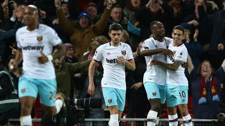 LIVERPOOL, ENGLAND - DECEMBER 11:  Michail Antonio (2nd R) of West Ham United celebrates scoring his team's second goal with his team mates Manuel Lanzini 