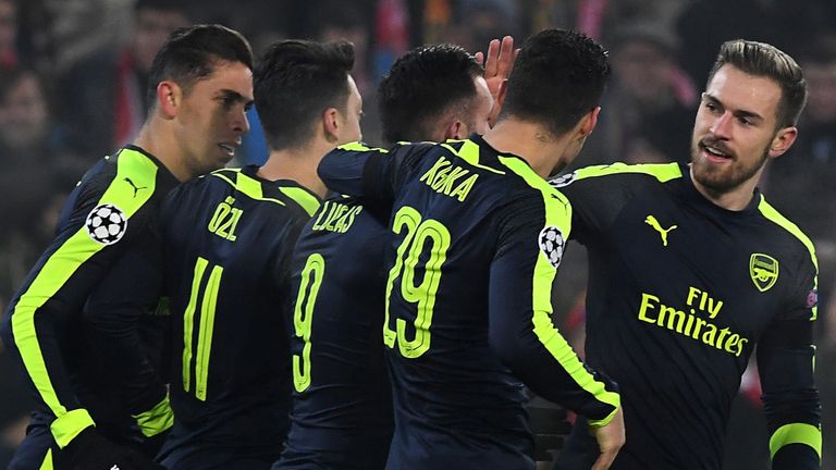 Arsenal's players celebrate after Arsenal's Spanish forward Lucas Perez (3rdL) scored a goal