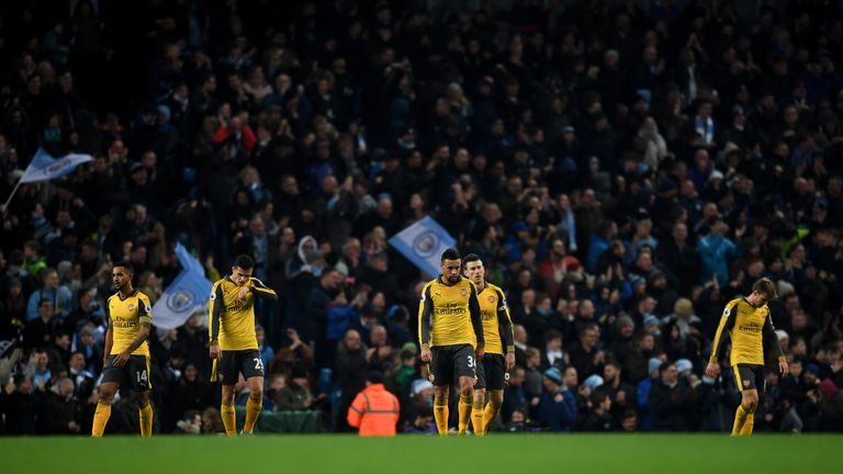 MANCHESTER, ENGLAND - DECEMBER 18: The Arsenal team are dejected after Manchester City score their second goal of the game during the Premier League match 
