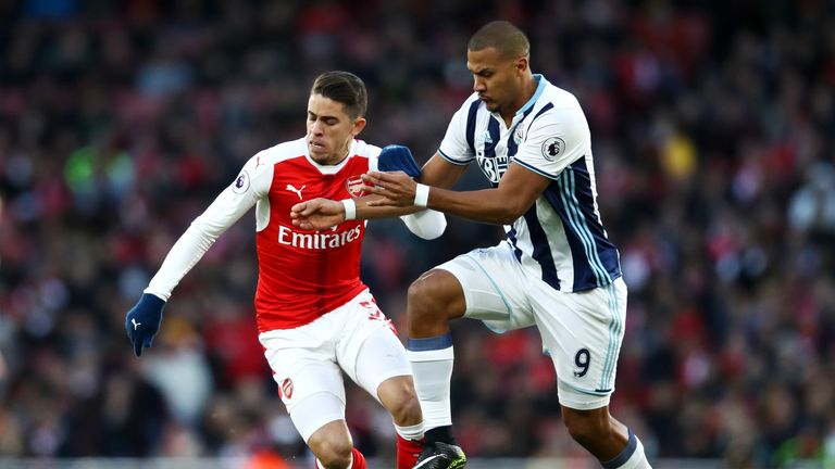 Gabriel Paulista tries to get away from Salomon Rondon 