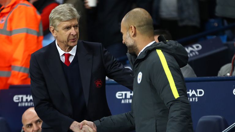 MANCHESTER, ENGLAND - DECEMBER 18:  Arsene Wenger, Manager of Arsenal (L) and Josep Guardiola, Manager of Manchester City (R) shake hands prior to kick off
