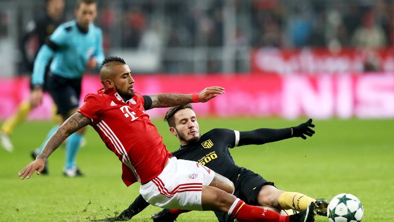 Arturo Vidal slides in for the ball during Bayern Munich's Champions League game at home to Atletico Madrid