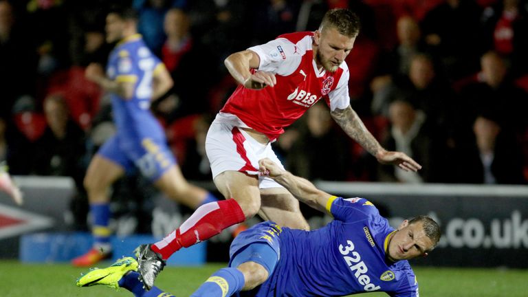 Fleetwood Town's Ashley Eastham (top) challenges Leeds United's Chris Wood during the EFL Cup, First Round match at Highbury Stadium, Fleetwood.