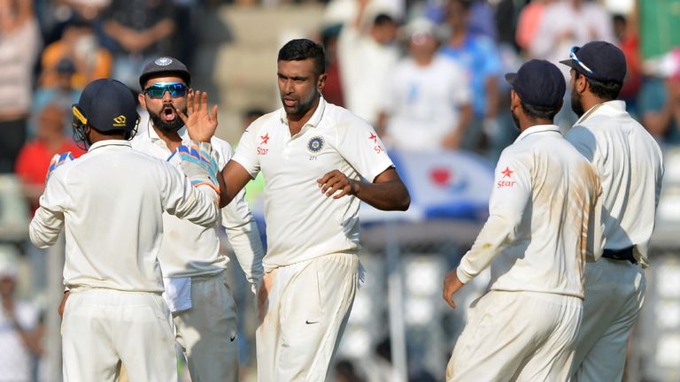India's Ravichandran Ashwin (C) celebrates with captain Virat Kohli (2L) and teammates after the dismissal of England's Ben Stokes on the fourth day of the