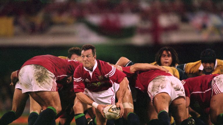 Rob Howley of the British Lions passes the ball on during the First Test Match against Australia