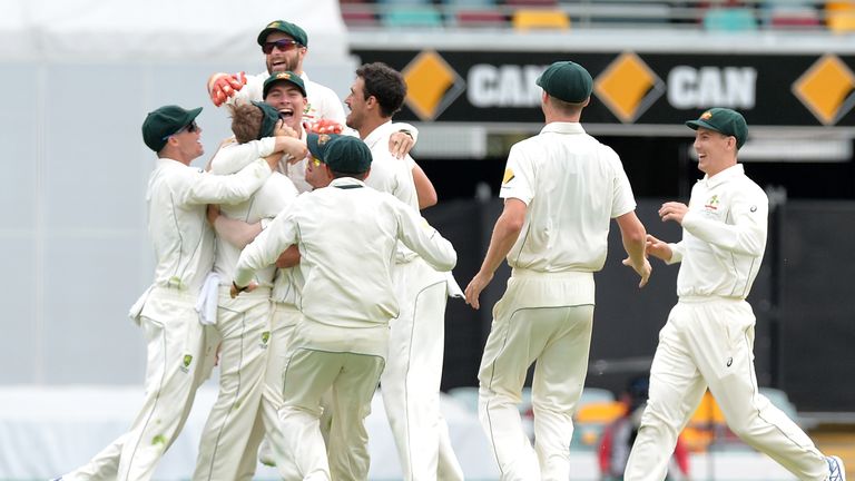The Australian team celebrate victory on day five of the first Test match against Pakistan at The Gabba