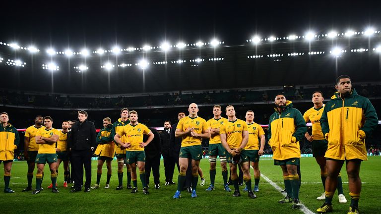 LONDON, ENGLAND - DECEMBER 03: The Australia team are dejected as they watch England celebrate during the Old Mutual Wealth Series match between England an