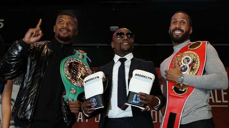 Badou Jack and James DeGale, with Floyd Mayweather in the middle