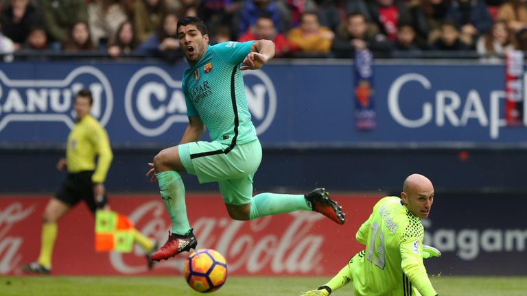 Barcelona forward Luis Suarez misses a chance