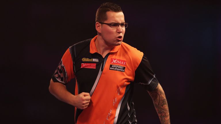 LONDON, ENGLAND - DECEMBER 23:  Benito van de Pas of the Netherlands celebrates winning the first set against Terry Jenkins of Great Britain during day nin
