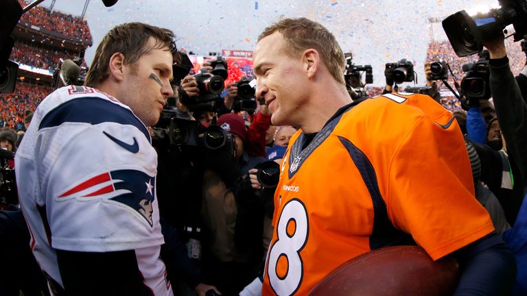 DENVER, CO - JANUARY 24:  Peyton Manning #18 of the Denver Broncos and Tom Brady #12 of the New England Patriots speak after the AFC Championship game at S