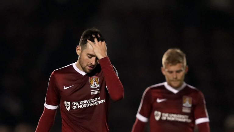 Northampton Town's Brendan Moloney (left) appears dejected after the final whistle during the EFL Cup, Third Round match at Sixfields Stadium, Northampton.