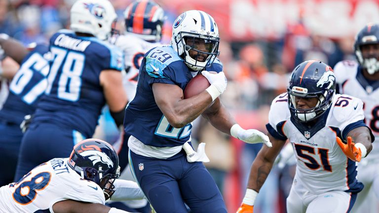 DeMarco Murray #29 of the Tennessee Titans is tackled by Shaquil Barrett #48 of the Denver Broncos at Nissan Stadium
