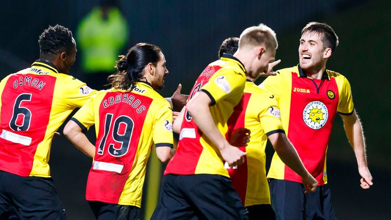 Partick Thistle's Callum Booth (right) celebrates scoring the opening goal against Dundee