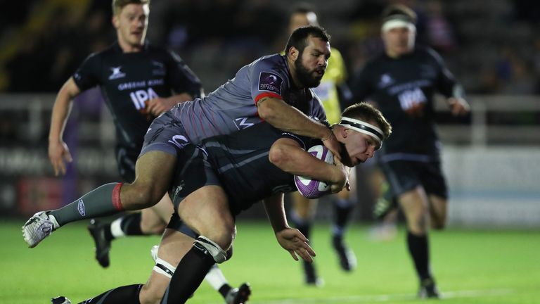 NEWCASTLE UPON TYNE, ENGLAND - DECEMBER 18: Callum Chick of Newcastle Falcons runs in to score a try during the European Rugby Challenge Cup match between 
